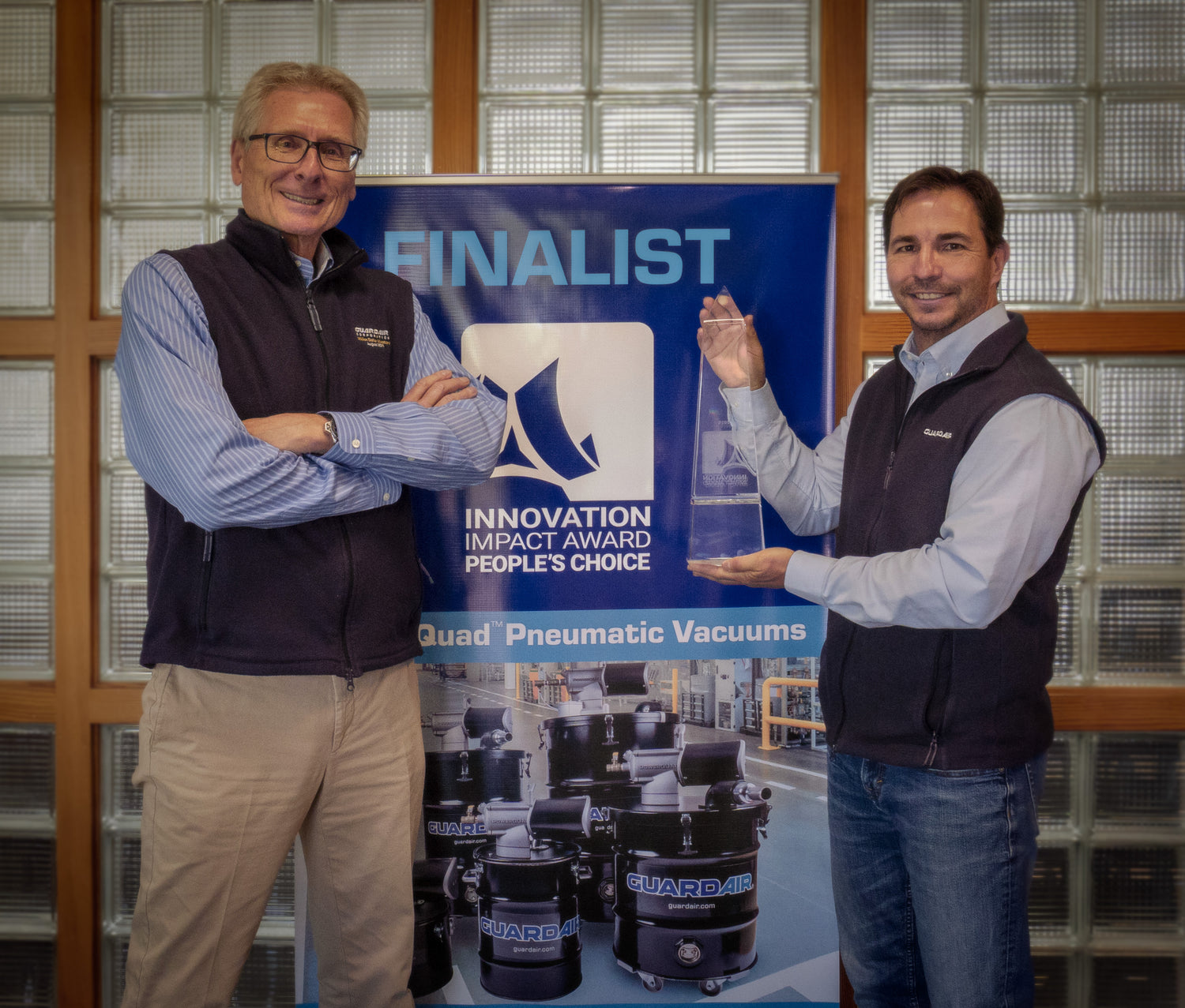 Tom and Mark with the 2025 ISA Innovation Impact Award Trophy